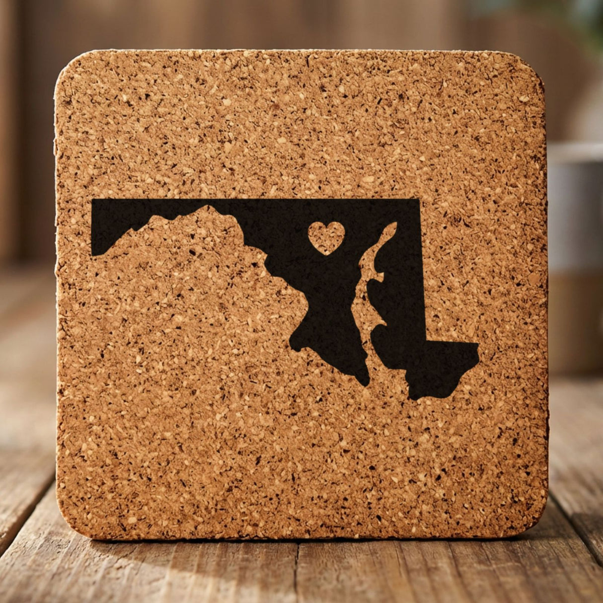Maryland square cork coaster engraved with the state shape and a heart