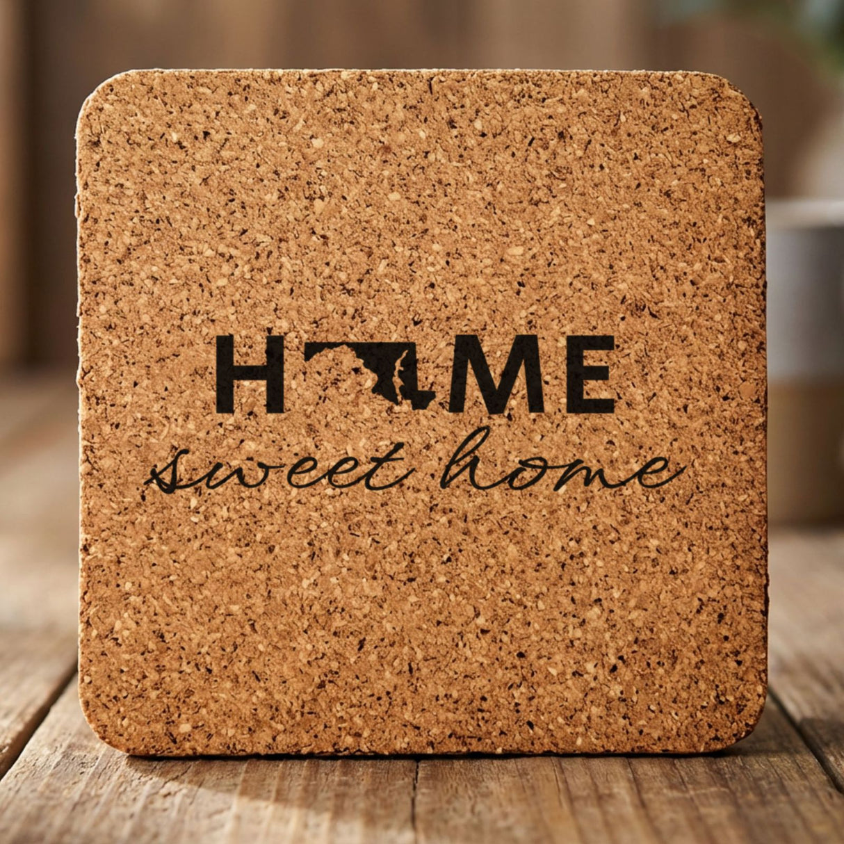 Maryland square cork coaster engraved with HOME sweet home using the state shape as the letter O
