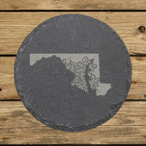 Maryland round slate coaster engraved with the state shape in ornate floral scrollwork