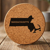 Massachusetts round cork coaster engraved with the state shape and MASSACHUSETTS in bold lettering