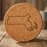 Massachusetts round cork coaster engraved with a clean state outline