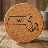 Massachusetts round cork coaster engraved with the state outline and MA initials