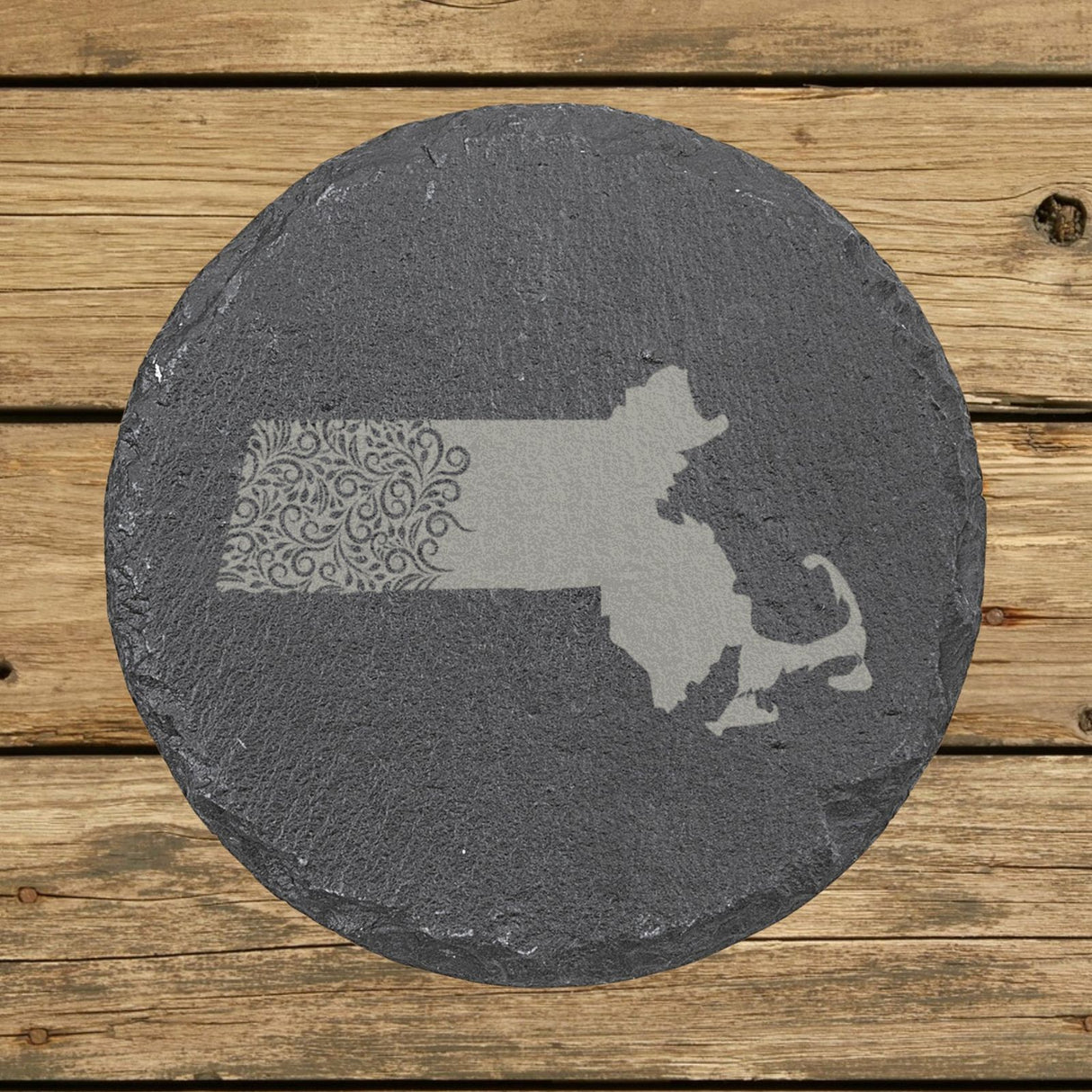 Massachusetts round slate coaster engraved with the state shape in ornate floral scrollwork