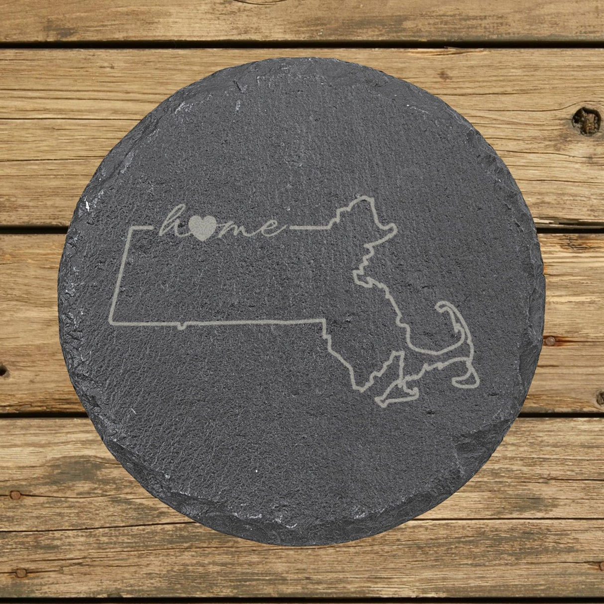 Massachusetts round slate coaster engraved with the state outline and home in script with a heart