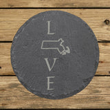 Massachusetts round slate coaster engraved with LOVE stacked vertically using the state as the letter O