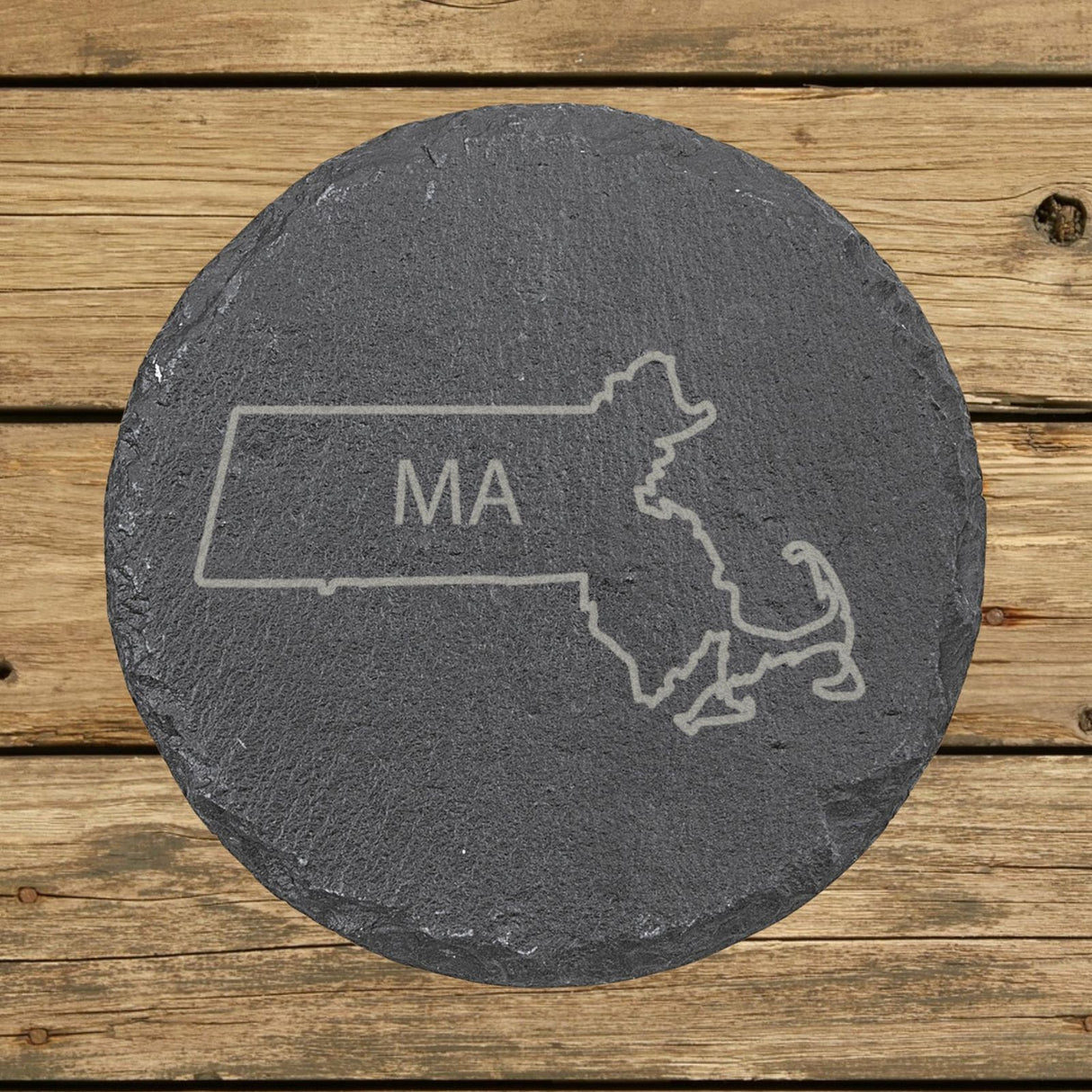 Massachusetts round slate coaster engraved with the state outline and MA initials