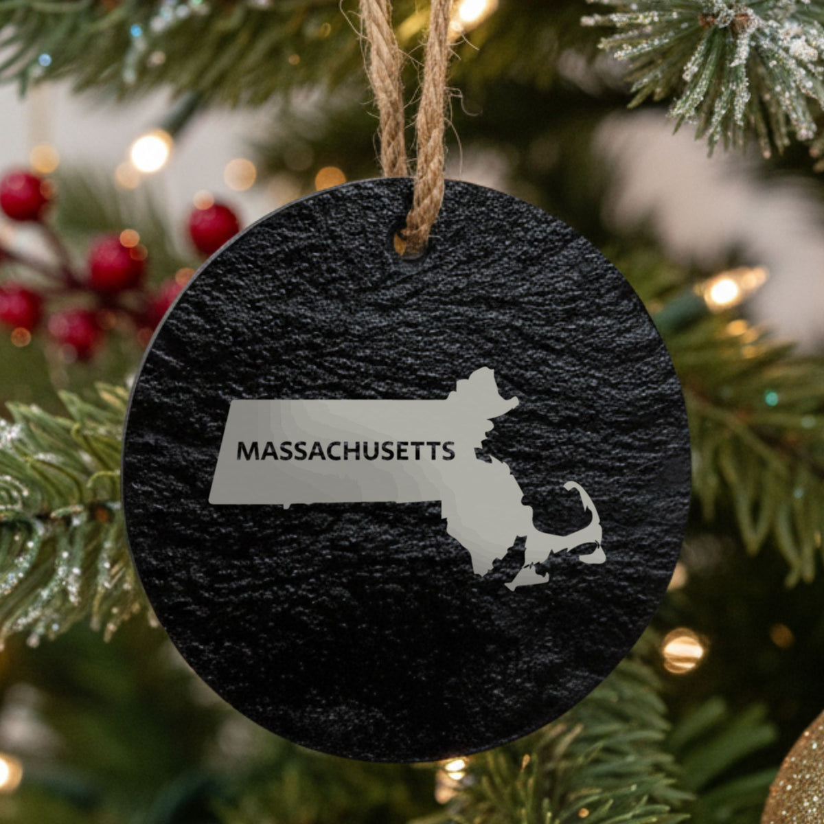Massachusetts round slate Christmas ornament engraved with the state shape and MASSACHUSETTS in bold lettering