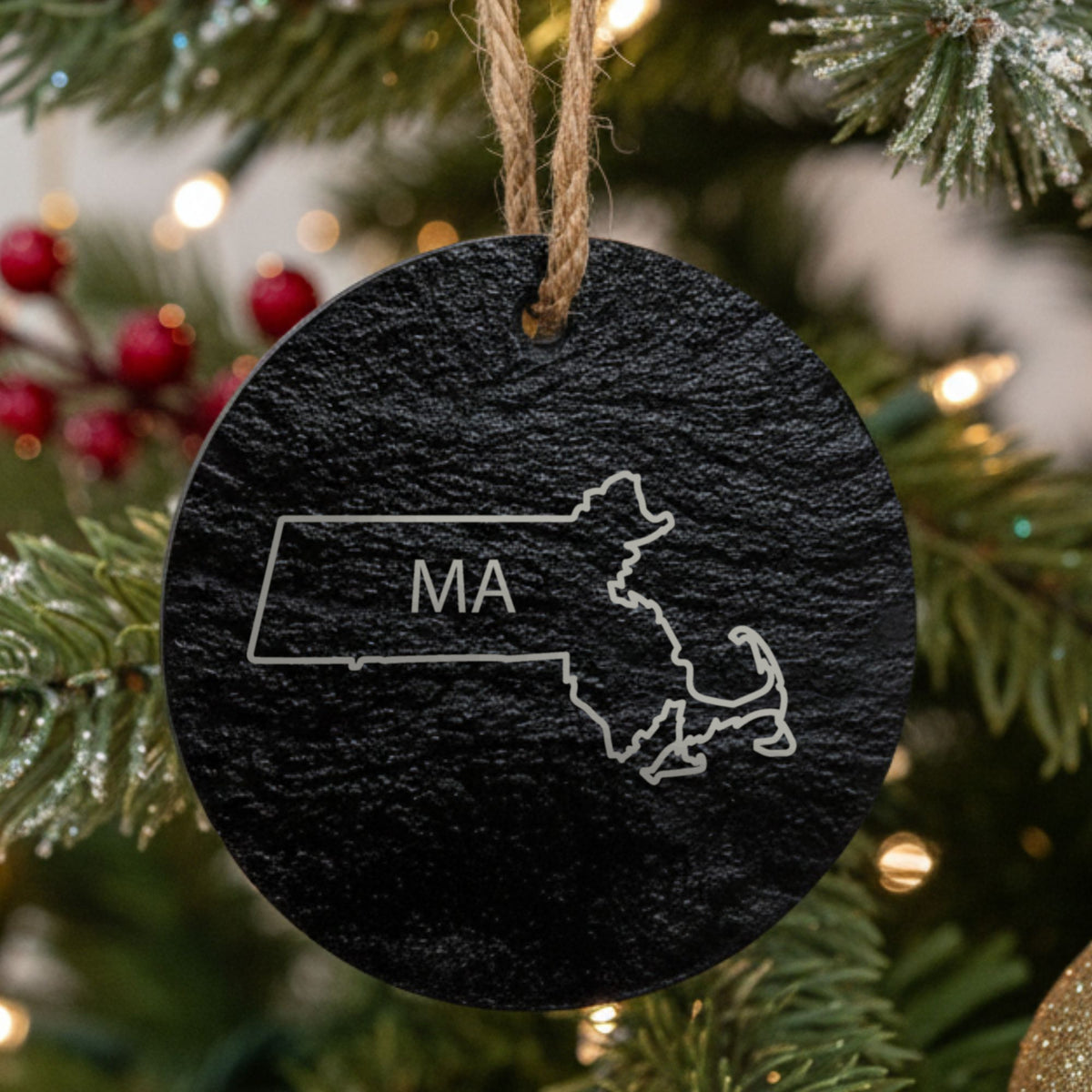 Massachusetts round slate Christmas ornament engraved with the state outline and MA initials