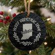 Round slate Christmas ornament engraved Merry Christmas From Indiana, with the state shape in a laurel wreath