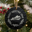 Round slate Christmas ornament engraved Merry Christmas From Kentucky, with the state shape in a laurel wreath