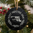 Round slate Christmas ornament engraved Merry Christmas From Maryland, with the state shape in a laurel wreath
