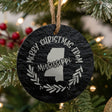 Round slate Christmas ornament engraved Merry Christmas From Mississippi, with the state shape in a laurel wreath