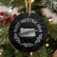 Round slate Christmas ornament engraved Merry Christmas From Pennsylvania, with the state shape in a laurel wreath
