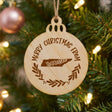 Round wood Christmas ornament engraved Merry Christmas From Tennessee, with the state shape in a laurel wreath