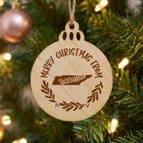 Round wood Christmas ornament engraved Merry Christmas From Tennessee, with the state shape in a laurel wreath