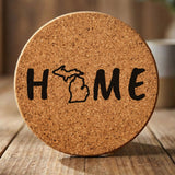 Michigan round cork coaster engraved with HOME using the state outline as the letter O
