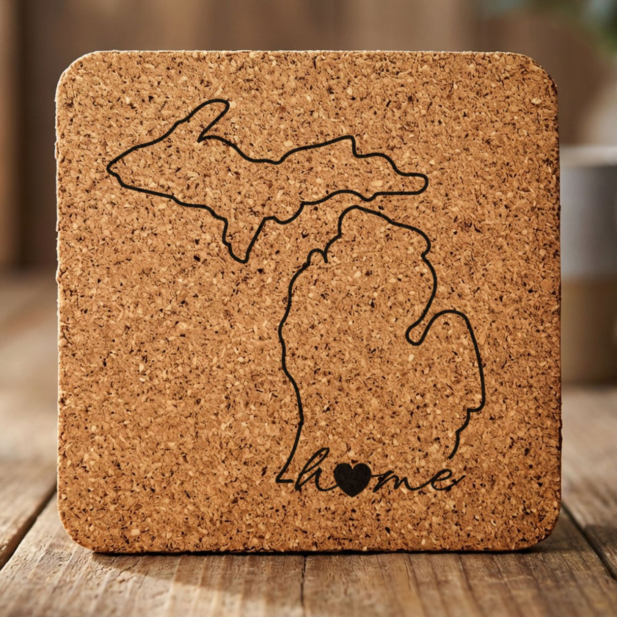 Michigan square cork coaster engraved with the state outline and home in script with a heart