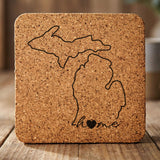 Michigan square cork coaster engraved with the state outline and home in script with a heart