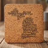 Michigan square cork coaster engraved with a word cloud of repeating Michigan text