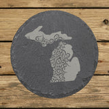 Michigan round slate coaster engraved with the state shape in ornate floral scrollwork