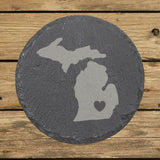 Michigan round slate coaster engraved with the state shape and a heart
