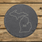 Michigan round slate coaster engraved with the state outline and MI initials