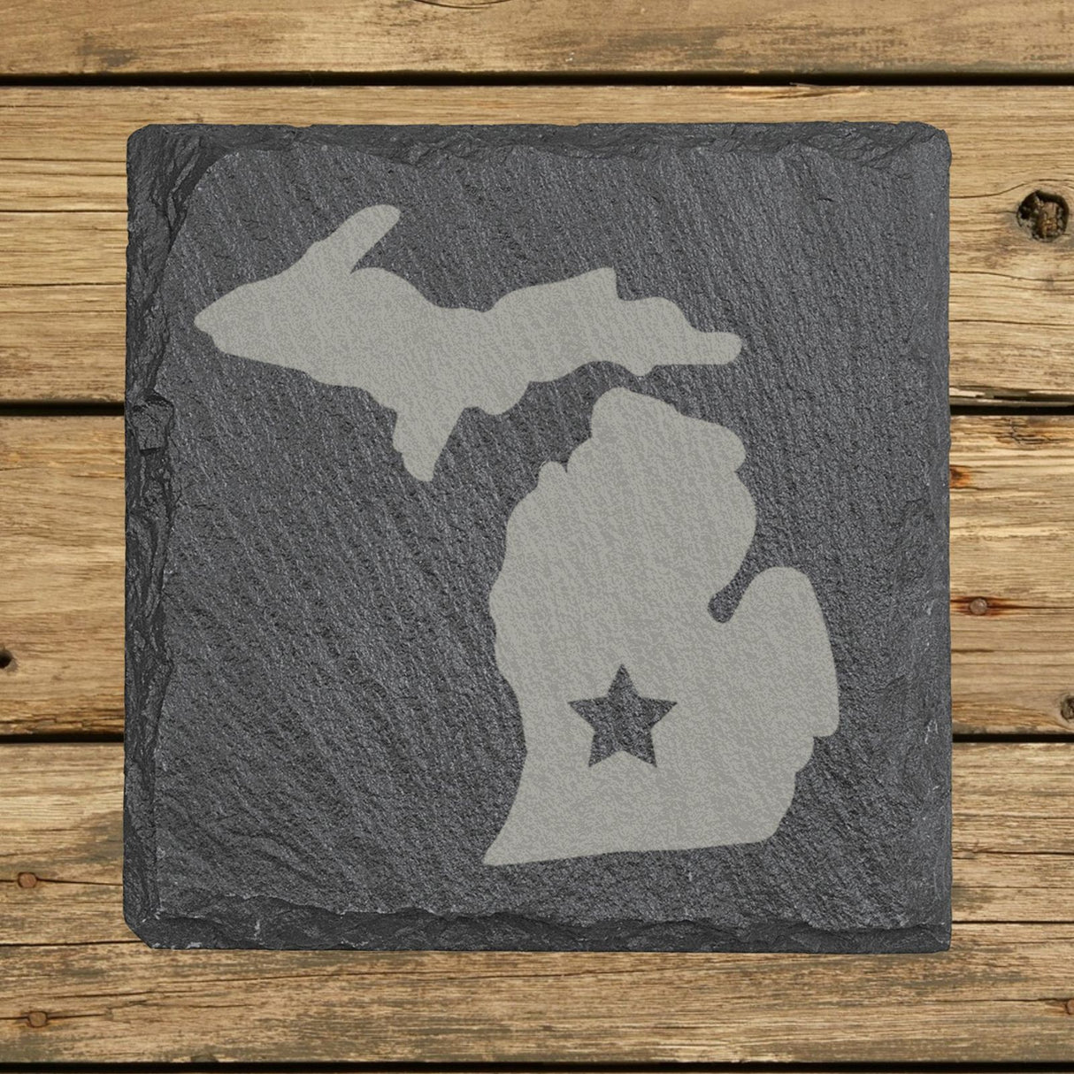 Michigan square slate coaster engraved with the state shape and a star