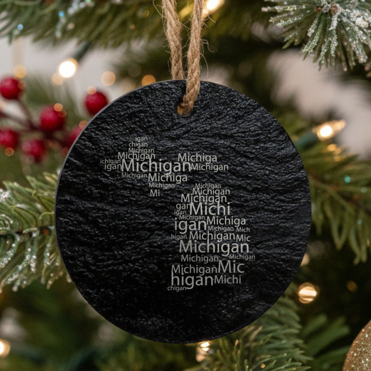 Michigan round slate Christmas ornament engraved with a word cloud of repeating Michigan text