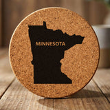 Minnesota round cork coaster engraved with the state shape and MINNESOTA in bold lettering