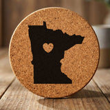 Minnesota round cork coaster engraved with the state shape and a heart