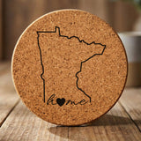 Minnesota round cork coaster engraved with the state outline and home in script with a heart
