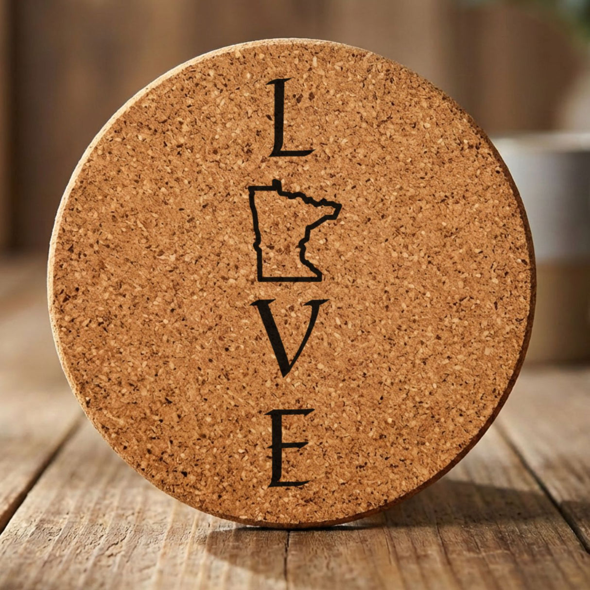Minnesota round cork coaster engraved with LOVE stacked vertically using the state as the letter O