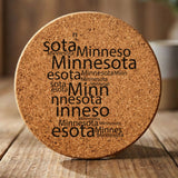 Minnesota round cork coaster engraved with a word cloud of repeating Minnesota text
