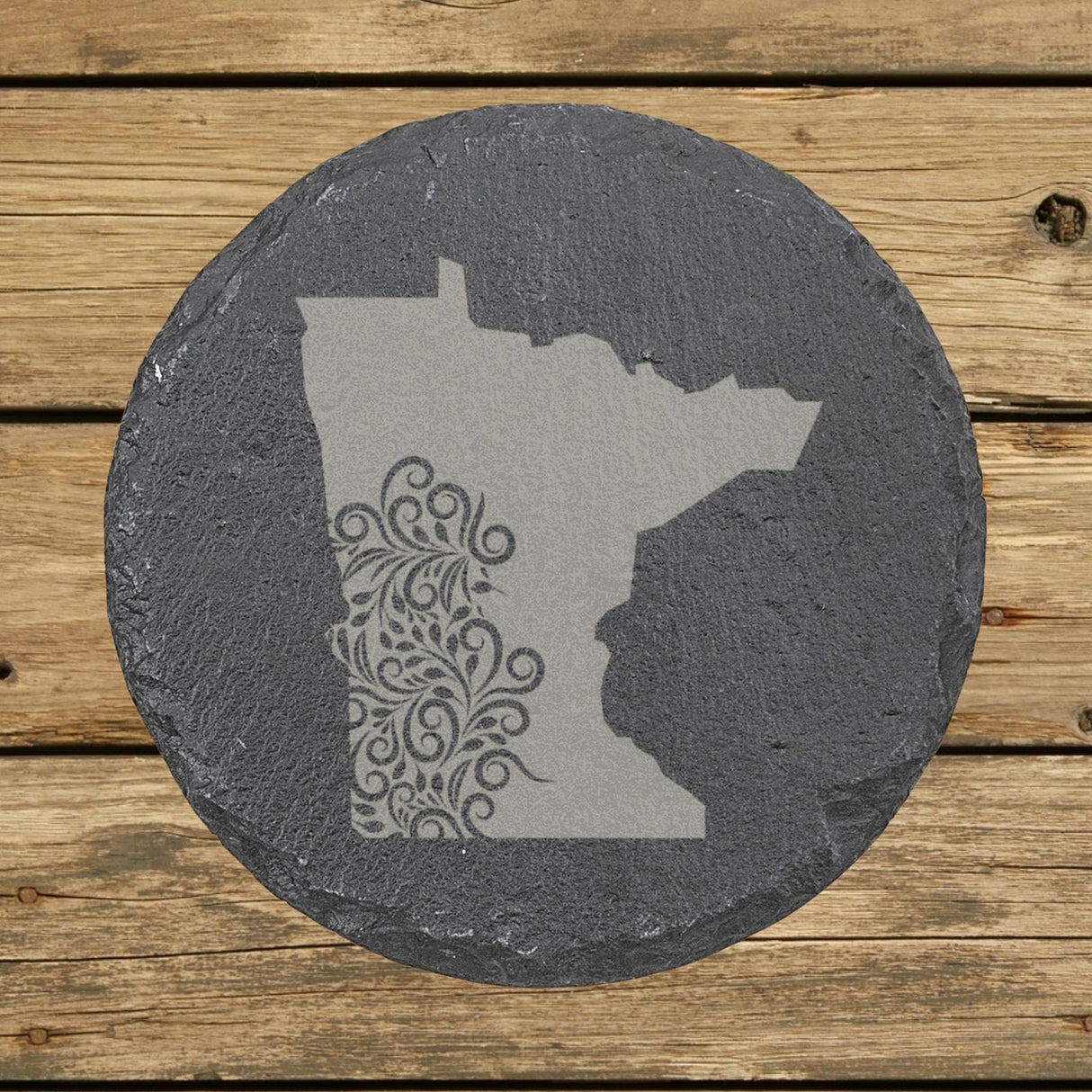Minnesota round slate coaster engraved with the state shape in ornate floral scrollwork