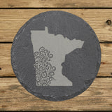 Minnesota round slate coaster engraved with the state shape in ornate floral scrollwork