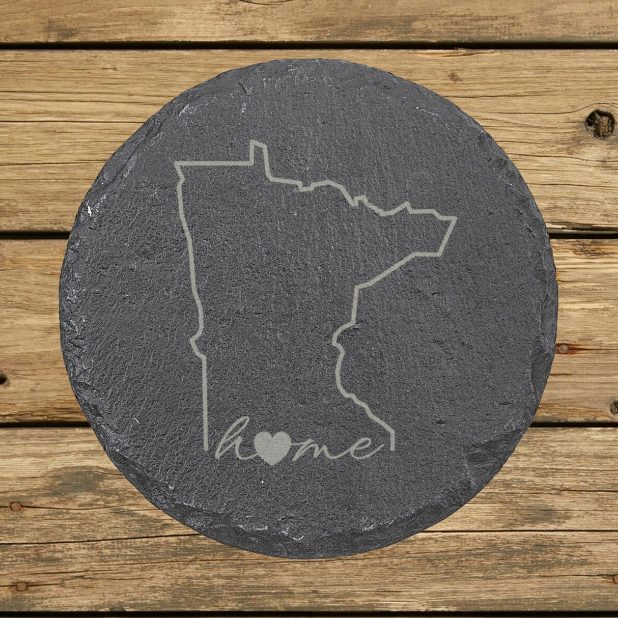 Minnesota round slate coaster engraved with the state outline and home in script with a heart