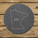 Minnesota round slate coaster engraved with the state outline and MN initials