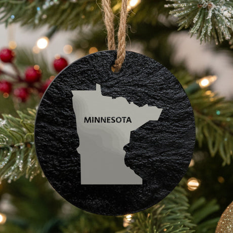 Minnesota round slate Christmas ornament engraved with the state shape and MINNESOTA in bold lettering