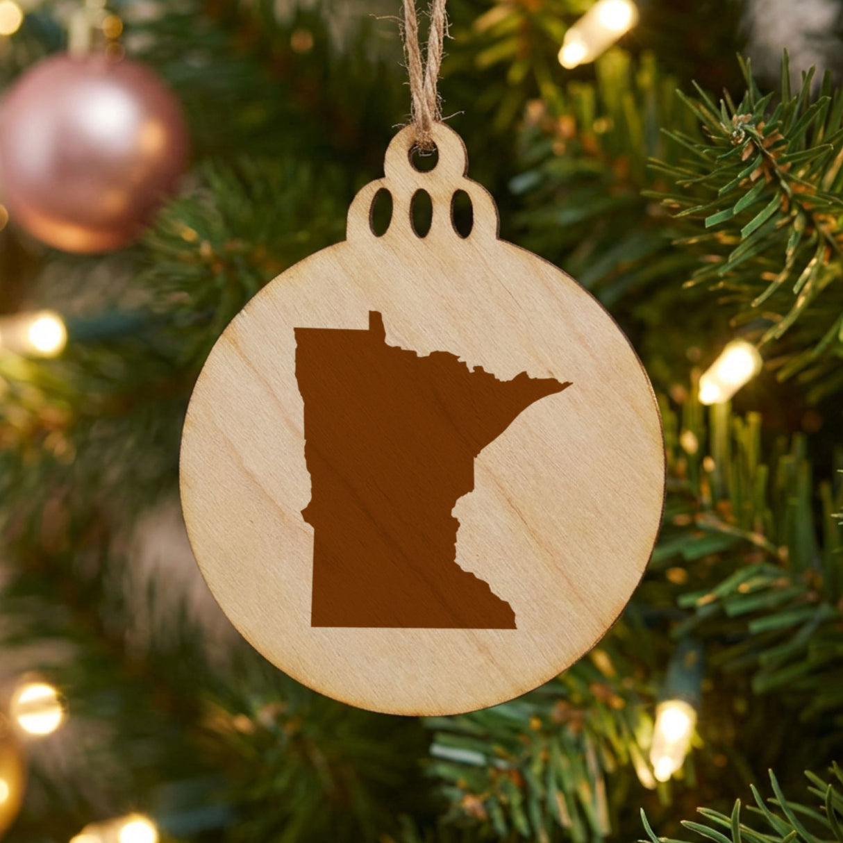 Minnesota round wood Christmas ornament with the full state shape engraved