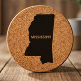 Mississippi round cork coaster engraved with the state shape and MISSISSIPPI in bold lettering
