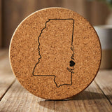 Mississippi round cork coaster engraved with the state outline and home in script with a heart