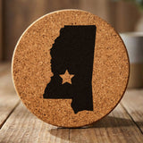 Mississippi round cork coaster engraved with the state shape and a star