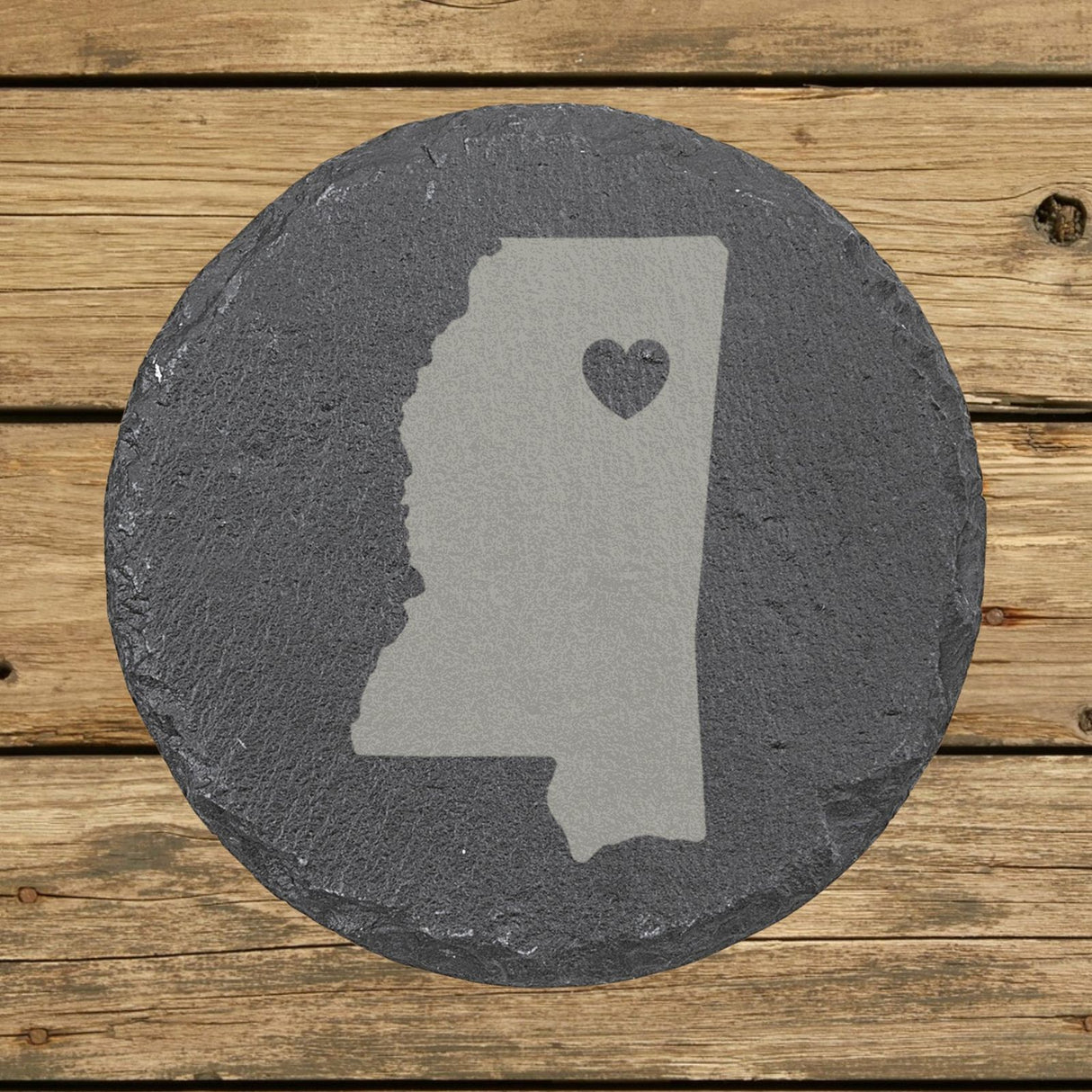 Mississippi round slate coaster engraved with the state shape and a heart