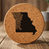 Missouri round cork coaster engraved with the state shape in ornate floral scrollwork