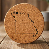 Missouri round cork coaster engraved with the state outline and home in script with a heart