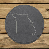Missouri round slate coaster engraved with the state outline and Missouri in script lettering