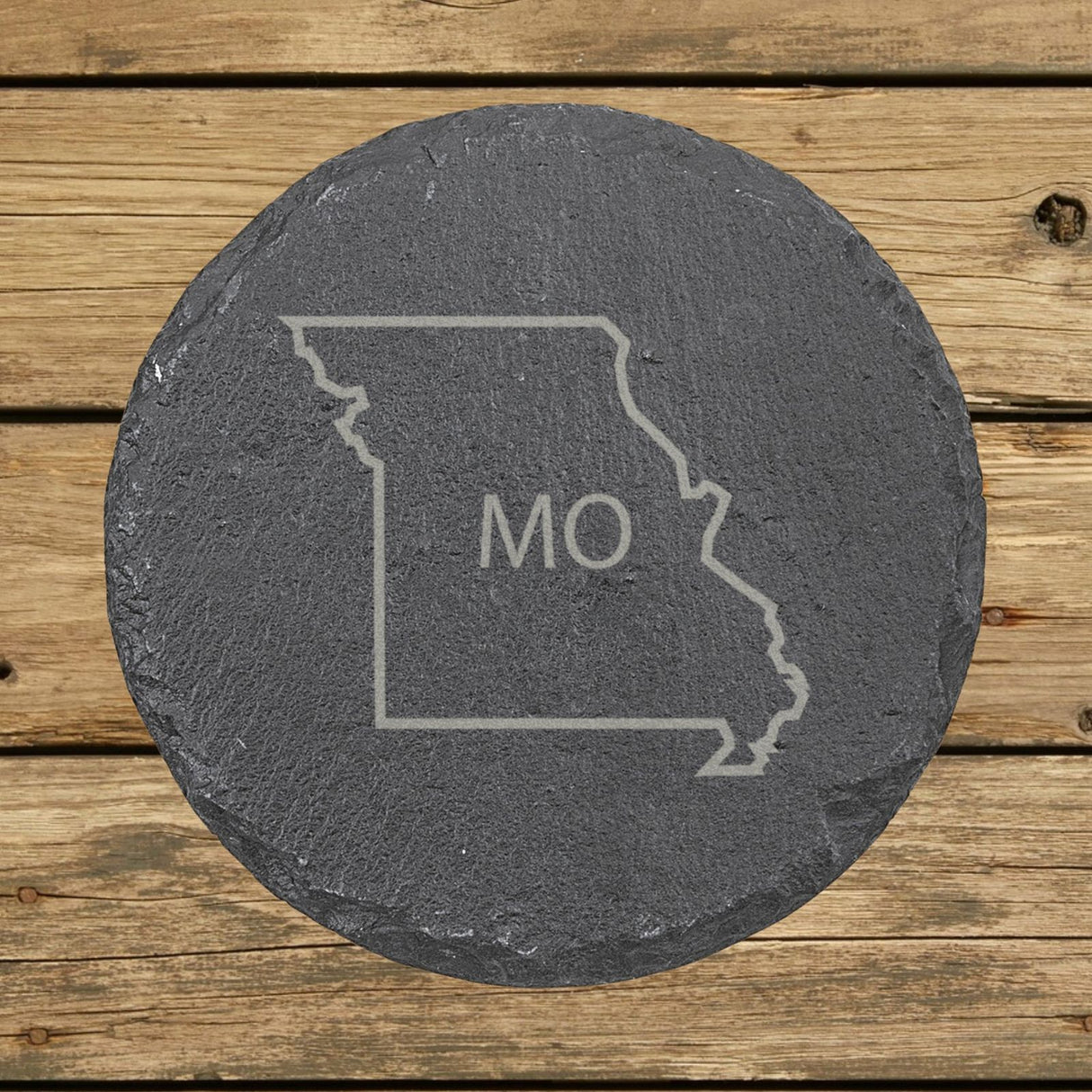 Missouri round slate coaster engraved with the state outline and MO initials