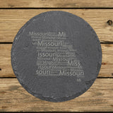Missouri round slate coaster engraved with a word cloud of repeating Missouri text