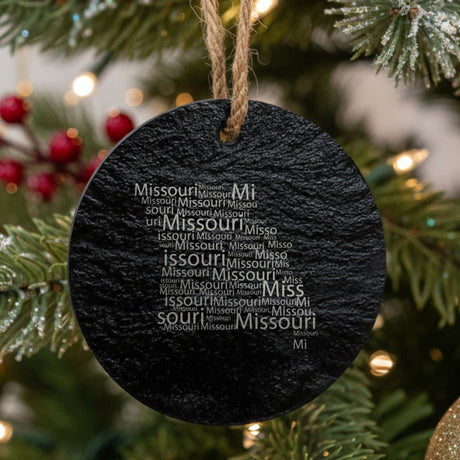 Missouri round slate Christmas ornament engraved with a word cloud of repeating Missouri text