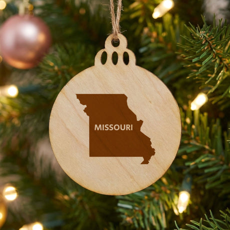 Missouri round wood Christmas ornament engraved with the state shape and MISSOURI in bold lettering